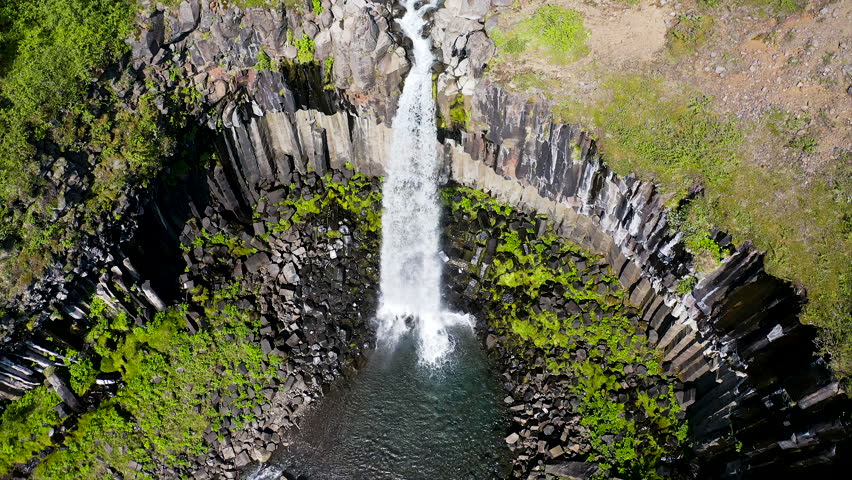 Aerial view of the spectacular Svartifoss waterfall, into the Skaftafell area of Vatnajokull National Park provides visitors with a breathtaking view of Svartifoss (Black Falls).