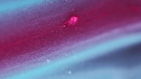Sparkling particles. Bokeh light. Defocused shimmering red blue color sand texture ink wave motion abstract art background. - Powered by Shutterstock - Get 15% off with code: PIKWIZARD15