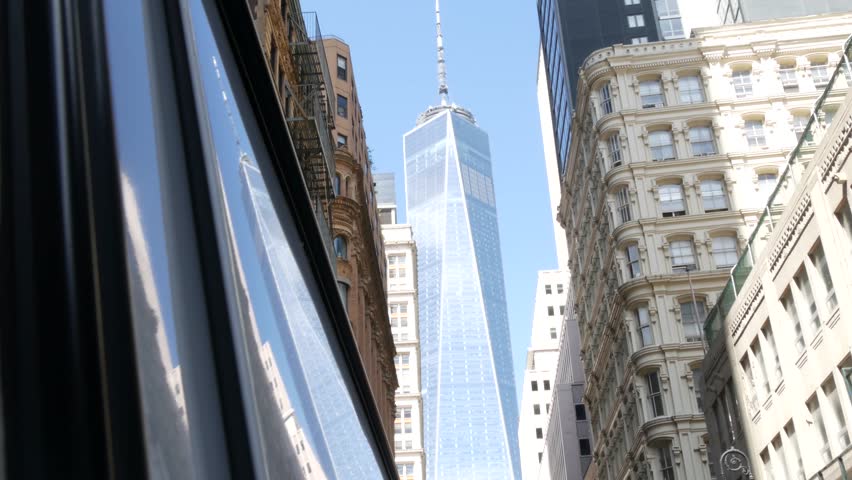 New York City Lower Manhattan, Downtown Financial District architecture, United States. One World Trade Center skyscraper building, Fulton street, USA. American urban scene. WTC Freedom tower in NYC.