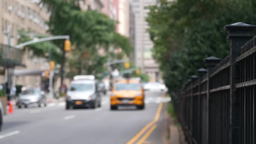New York City Park Avenue. Grand Central Terminal railway station on 42 street. Manhattan Midtown. Yellow taxi cab in NYC, USA. American urban road car traffic, transport in United States. Defocused.