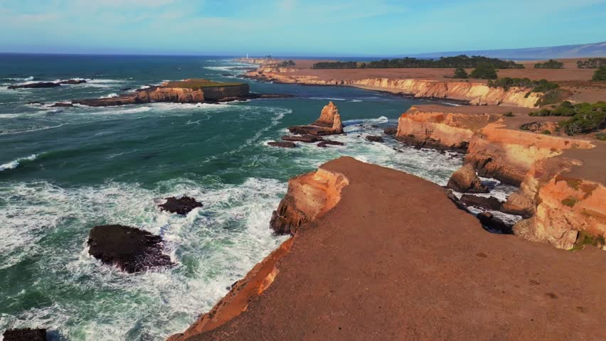 Sunny daytime Mendocino coast islands Point Arena Rock Lighthouse aerial drone view California rugged coastline wave swell rocky Rocas Fort Bragg San Fran Northern Pacific Ocean Coastal forward up