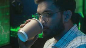 Arabian Indian man holding cup drinking coffee male programmer coder technology cryptocurrency bitcoin work trader network freelance guy businessman e-commerce hacker crypto developer business home - Powered by Shutterstock - Get 15% off with code: PIKWIZARD15