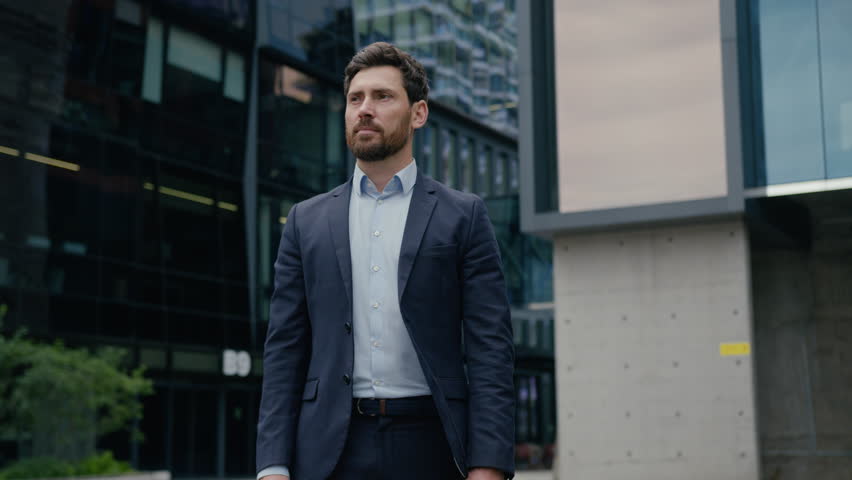 Businessman Caucasian guy formal suit man business entrepreneur investor leader employer trader crossed hands pose outdoors confident male real estate agent city architect downtown looking at camera