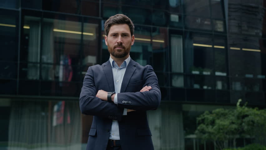 Businessman Caucasian guy formal suit man business entrepreneur investor leader employer trader crossed hands pose outdoors confident male real estate agent city architect downtown looking at camera