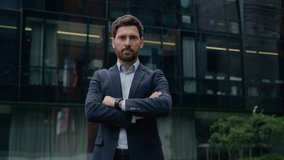 Businessman Caucasian guy formal suit man business entrepreneur investor leader employer trader crossed hands pose outdoors confident male real estate agent city architect downtown looking at camera - Powered by Shutterstock - Get 15% off with code: PIKWIZARD15