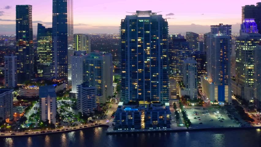 Beautiful aerial view of glowing skyscrapers with night sky in.