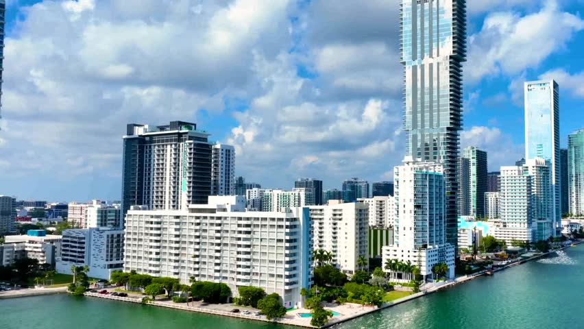 Downtown district of Miami city with luxury residential skyscraper buildings in Florida USA American megapolis with business financial district on sunny.
