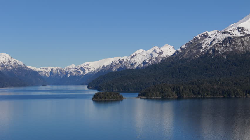 Snow-Capped Mountains Reflecting in Lake Nahuel Huapi, Patagonia. Conservation and Climate Awareness