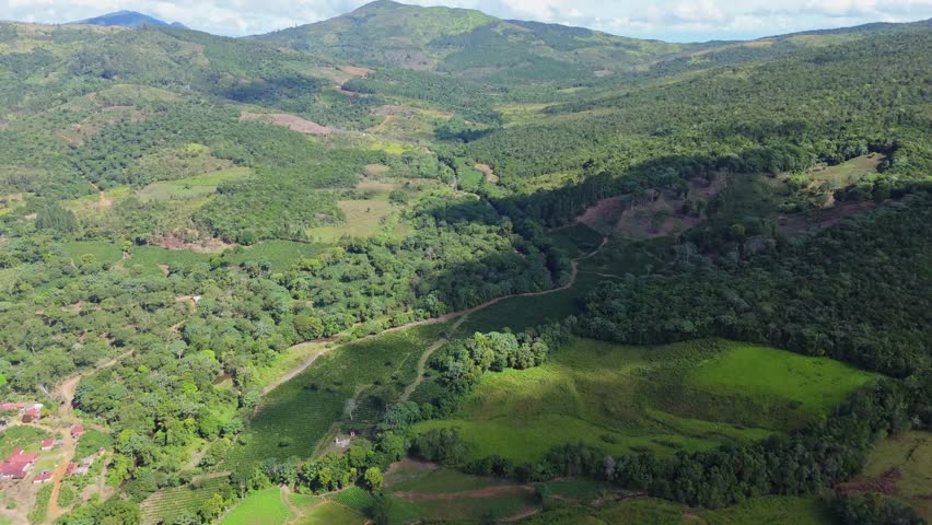 Mountain landscape from above in Montaña La Humeadora National Park, San José de Ocoa, showcasing the natural beauty of green mountains and virgin nature.