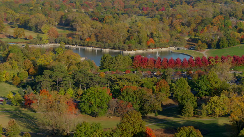 Aerial with a slow push towards the Grand Basin in Forest Park in St. Louis, Missouri on a beautiful Fall day.