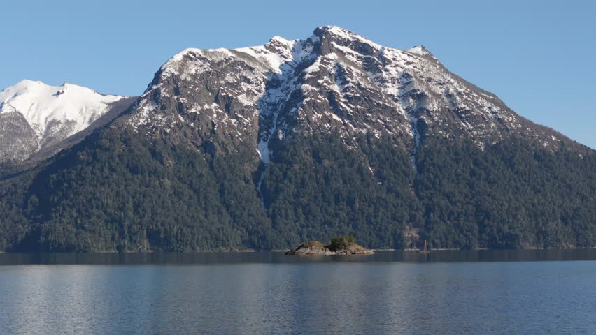 Untamed Beauty of Patagonia. Snow-Capped Peaks Reflecting in Pristine Lake Nahuel Huapi. Argentina.