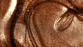 Liquid glitter background, mocha coffee color abstract backdrop. Flowing abstract paint surface. Beautiful metallic brown texture, swirls. Liquid Metallic paint close-up. Art Wallpaper waves, cosmetic - Powered by Shutterstock - Get 15% off with code: PIKWIZARD15