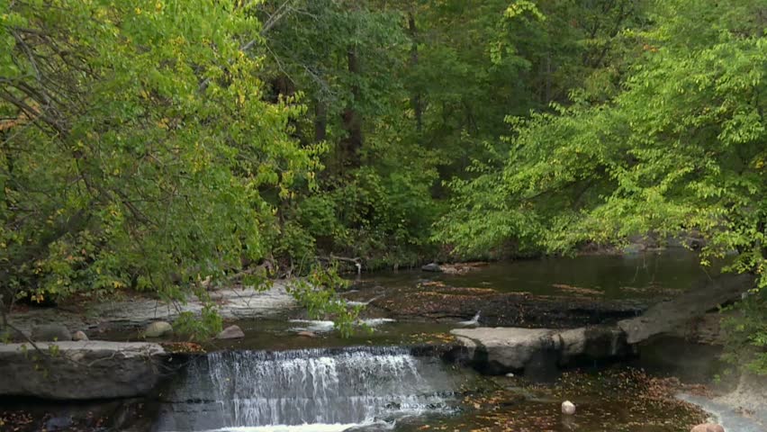 Small waterfall cascading over rocks in Cuyahoga Valley National Park stream