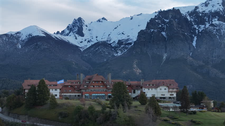 Scenic View of Llao Llao Hotel with Majestic Snow-Capped Andes Mountains in Patagonia, Argentina