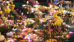 Loy Krathong Thailand festival. Close-up of many floating lotus flower lanterns with burning candles from eco sustainable materials different sizes and form - Powered by Shutterstock - Get 15% off with code: PIKWIZARD15