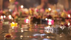 Loy Krathong Thailand festival. Close-up of many floating lotus flower lanterns with burning candles from eco sustainable materials different sizes and form - Powered by Shutterstock - Get 15% off with code: PIKWIZARD15