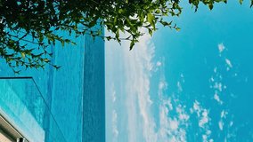 Vertical, Luxury Resort Hotel with Infinity Swimming Pool with Amazing Blue Turquoise Sea View Sky and Clouds, Slow Motion Nobody Relax Beauty Pool Beach Ocean Sunny Sky, Travel., Nobody Relax. - Powered by Shutterstock - Get 15% off with code: PIKWIZARD15