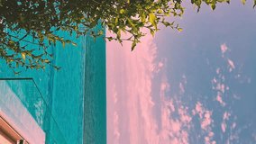 Vertical, Luxury Resort with Infinity Swimming Pool with Incredible Sunrise Sea View Lilac Blue Sky and Pink Clouds, Slow Motion Nobody Relax Beauty Pool Beach Sunset Villa Ocean Colorful Sky, Travel. - Powered by Shutterstock - Get 15% off with code: PIKWIZARD15