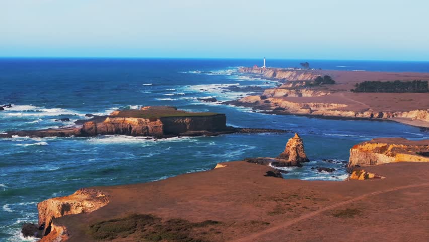 Stornetta coastal Trail Point Arena Lighthouse islands Racas Sea Lion Rocks Cove California aerial drone Mendocino coast vista point sunny daytime morning afternoon blue sky waves autumn upwards