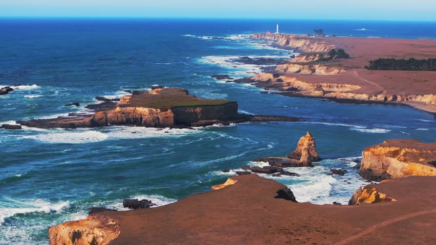 Stornetta coastal Trail Point Arena Lighthouse islands Racas Sea Lion Rocks Cove California aerial drone Mendocino coast vista point sun daytime morning afternoon blue sky waves autumn forward pan up