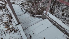old stairs in snow. slow motion video of concrete stairs with snow falling on them. winter snowy weather. - Powered by Shutterstock - Get 15% off with code: PIKWIZARD15