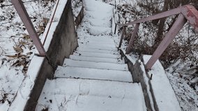 old stairs in snow. slow motion video of concrete stairs with snow falling on them. winter snowy weather. - Powered by Shutterstock - Get 15% off with code: PIKWIZARD15