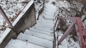 old stairs in snow. slow motion video of concrete stairs with snow falling on them. winter snowy weather. - Powered by Shutterstock - Get 15% off with code: PIKWIZARD15