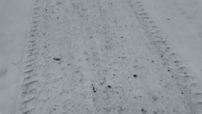 tire tracks on snow. tire tread marks on ground. winter tires. winter tire imprint on sega and ice. slow motion video - Powered by Shutterstock - Get 15% off with code: PIKWIZARD15