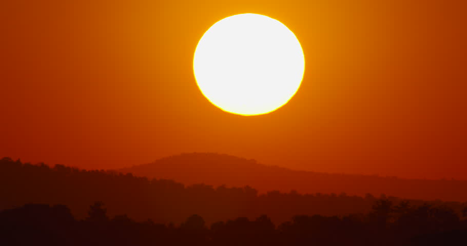 The big sunrise Timelapse Big sunrise video sky sunrise Telephoto lens close-up the sun. High quality video DCI4K ProRes422