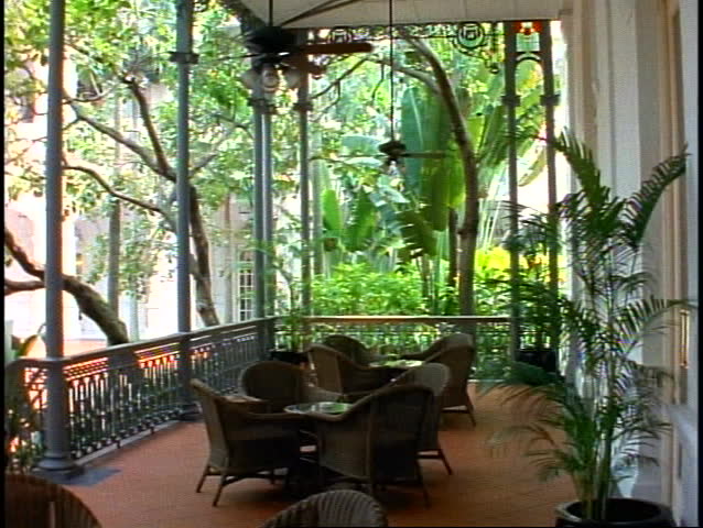 Singapore Raffles Hotel, veranda, wicker chairs, fans turning