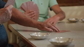 men playing card game in pub - Powered by Shutterstock - Get 15% off with code: PIKWIZARD15