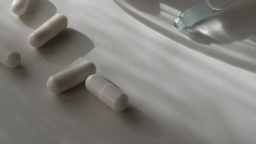 Single minerals, supplements and a dropper for Zinc, Magnesium, healthy vitamins for the body, close up, slow motion