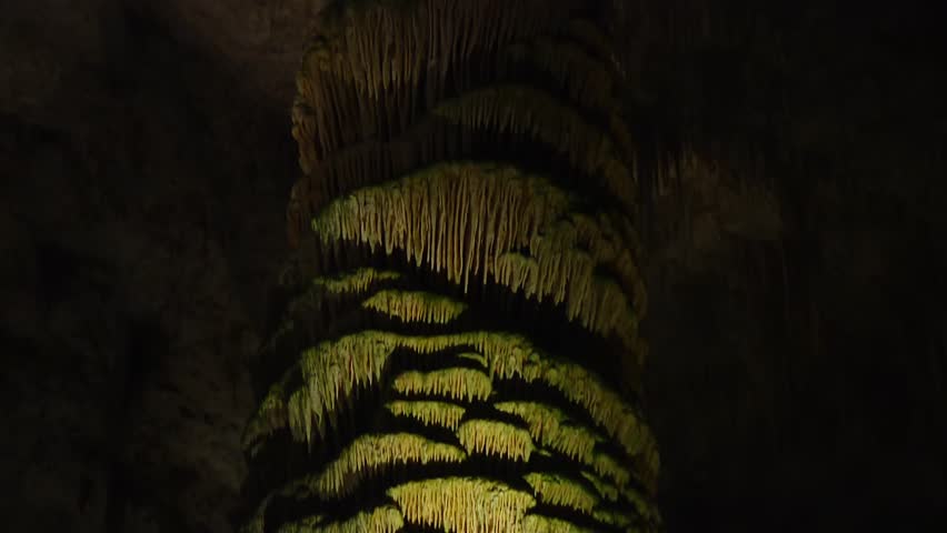 Zoomed-in view of intricate stalactite column in Carlsbad Caverns, New Mexico. Close up, boom jib down view