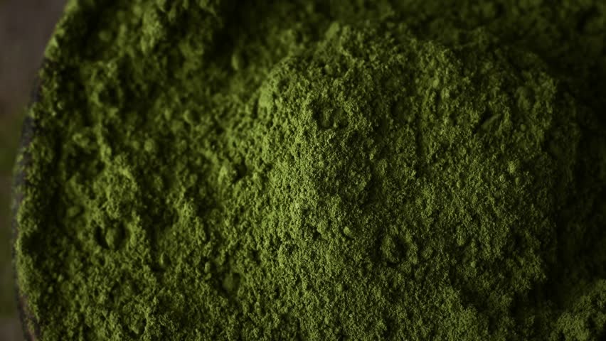 Matcha green tea powder rotating close up view