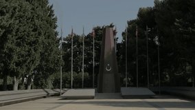 RAW video, Eternal Flame Monument in Baku, Azerbaijan Martyrs' cemetery with Azerbaijani flags - Powered by Shutterstock - Get 15% off with code: PIKWIZARD15
