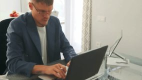 Businessman manages tasks on laptop, pausing for coffee in workflow rotation. - Powered by Shutterstock - Get 15% off with code: PIKWIZARD15