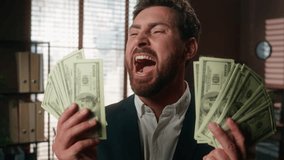 Happy excited winner rich Caucasian middle-aged 40s adult man business investor businessman male guy entrepreneur holding banknotes money dollars profit finance yelling screaming shouting in office - Powered by Shutterstock - Get 15% off with code: PIKWIZARD15