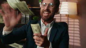 Happy excited winner Caucasian middle-aged adult man business businessman male guy entrepreneur throwing money rain banknotes flying dollars throw in air achieve victory financial success in office - Powered by Shutterstock - Get 15% off with code: PIKWIZARD15