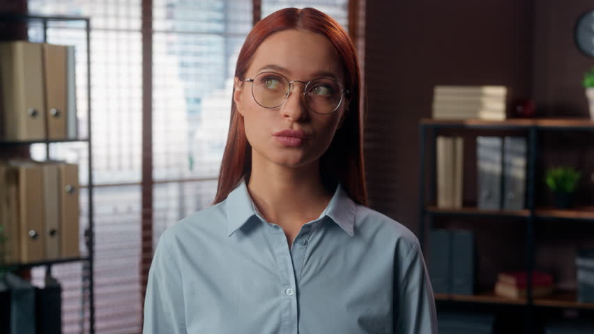 Caucasian pensive thinking thoughtful unsure hesitate pondering think idea clever plan solution businesswoman girl lady in glasses female business woman in office indoors company work decide decision