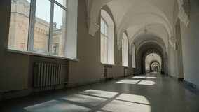 Empty corridor in university hall long college hallway academy high school indoors room without people students indoor building interior studying education learning sunlight sunbeams sun light windows - Powered by Shutterstock - Get 15% off with code: PIKWIZARD15