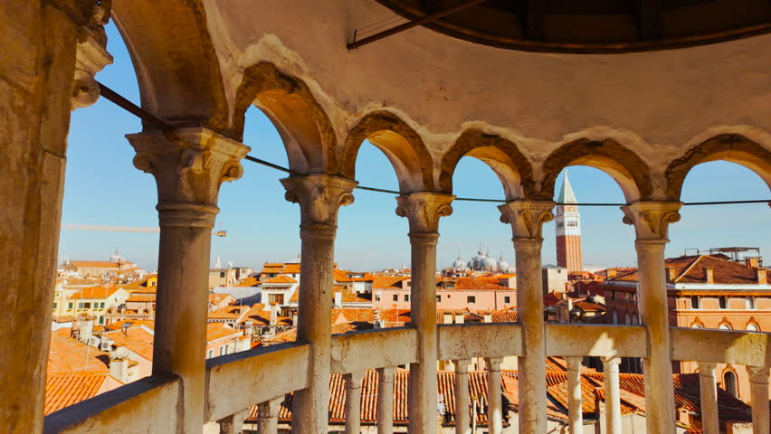 Stunning panoramic view of Venice, Italy seen through multiple arches, featuring the Campanile di San Marco (St Mark
