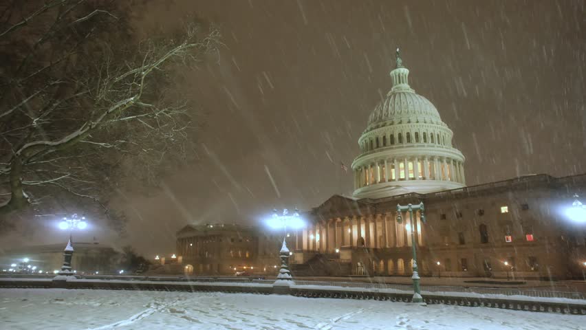 Capitol building at winter in snow. Capitol democracy in USA Washington DC, Capitol building USA. Washington monument. USA Congress. Capitol is symbolic of USA. Night winter in Washington D C.