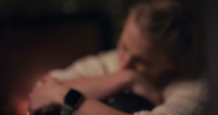 A sad woman cries at night, overwhelmed by depression and deep emotional pain.