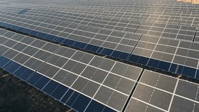 Aerial fly over solar panel farm in Siauliai city, Lithuania. Renewable energy in baltics, Europe union. Sustainable electric power plant with many rows of solar photovoltaic panels - Powered by Shutterstock - Get 15% off with code: PIKWIZARD15