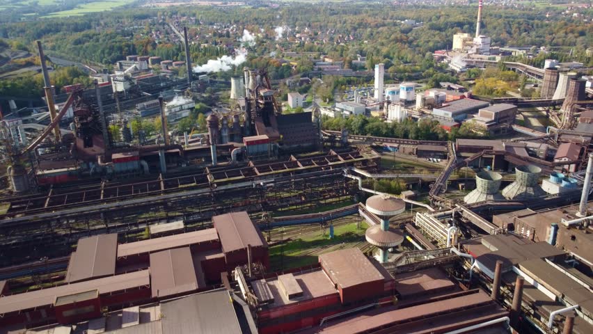Třinec steel factory, industrial structures surrounded by the city and greenery. Czech Republic