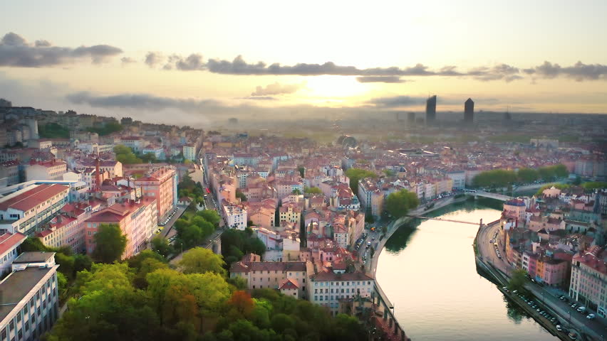 Lyon france city skyline aerial top view fly over river and old town in front skyscrapers lyon city centre drone footage.