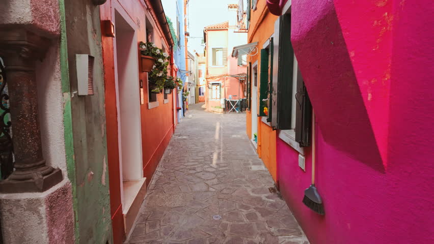 Revealing a street with colorful and traditional houses in the island of Burano, Venice, Italy. Venice is an archipelago of 126 islands linked by 472 bridges