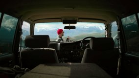 Handsome man enjoying a cup of coffee leaning on his off-road suv car in the middle of nature. weekend getaway. adventure and leisure time concept. - Powered by Shutterstock - Get 15% off with code: PIKWIZARD15