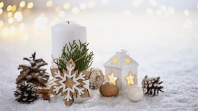 Female hand lights festive Christmas candles with a match. Merry Christmas! Christmas greeting card. White burning candles and Christmas decoration on snow and lights background. - Powered by Shutterstock - Get 15% off with code: PIKWIZARD15