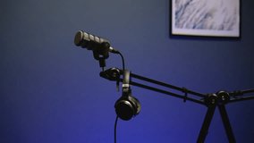 Microphone and Headphones Setup in Modern Podcast Studio - Powered by Shutterstock - Get 15% off with code: PIKWIZARD15